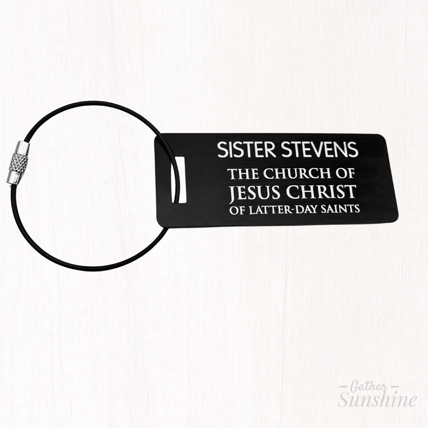 Black LDS-style missionary luggage tag in English. Size: 3x1 inch. Also in bold, colorful alternatives by GatherSunshine.