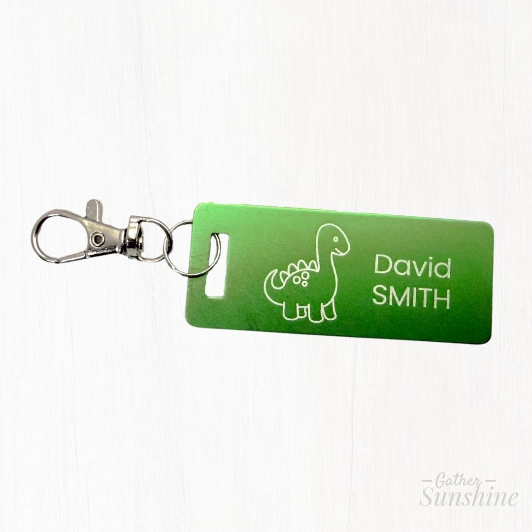 Green kids tag with dinosaur design and text on a white background