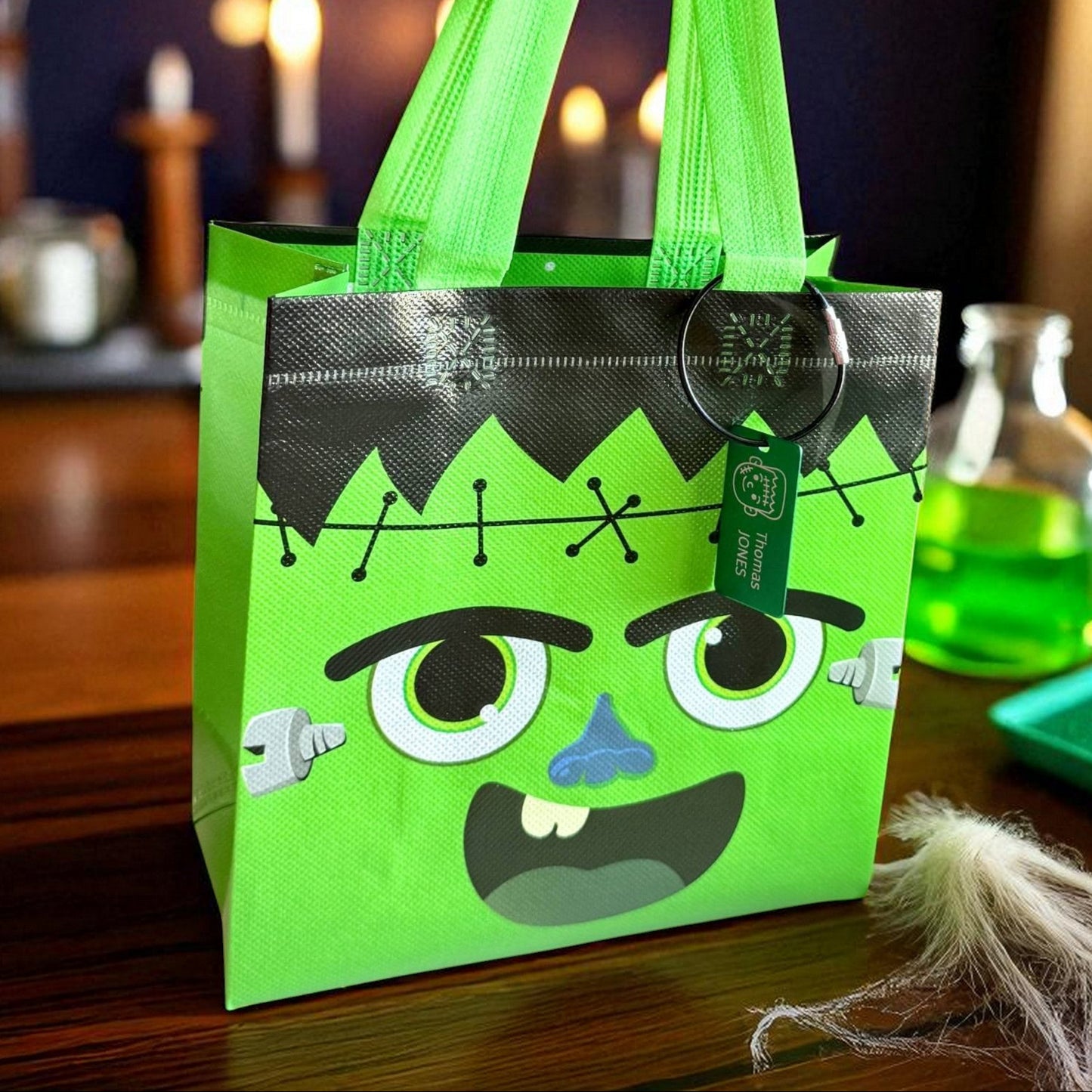 Frankenstein Halloween tote bag with custom name tag in cozy fall setting by Gather Sunshine.