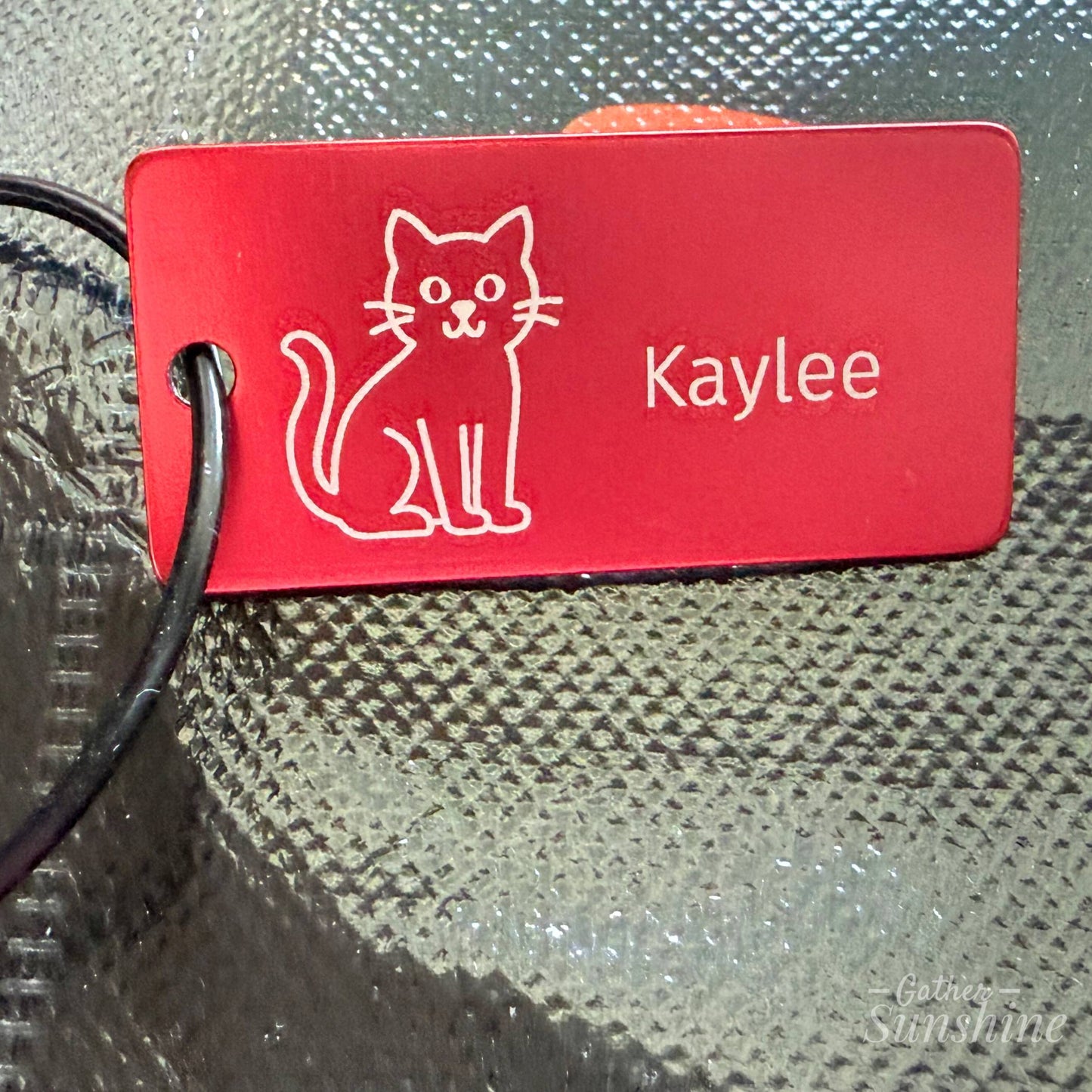 Halloween cat face trick-or-treat bag with personalized engraved cat name tag closeup, Gather Sunshine.