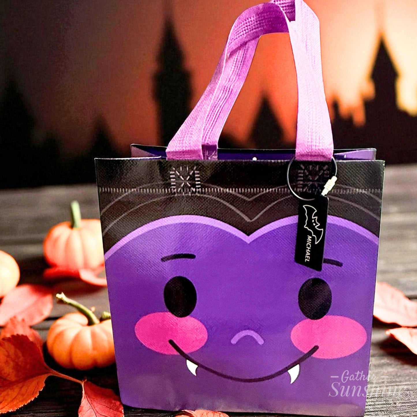 Bat Halloween tote bag with custom name tag in fall scene by Gather Sunshine.