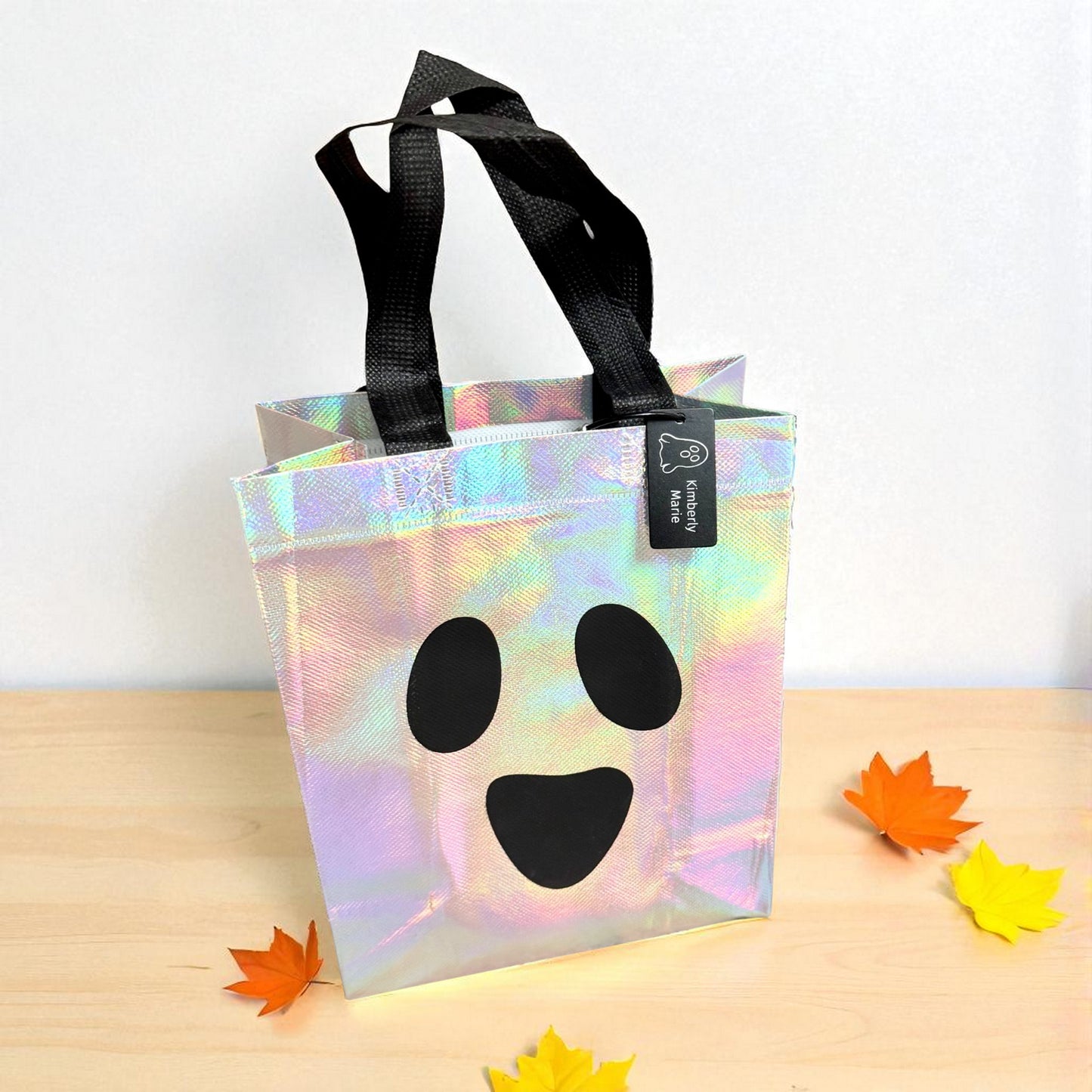 Iridescent ghost Halloween trick-or-treat bag with personalized engraved tag by Gather Sunshine.