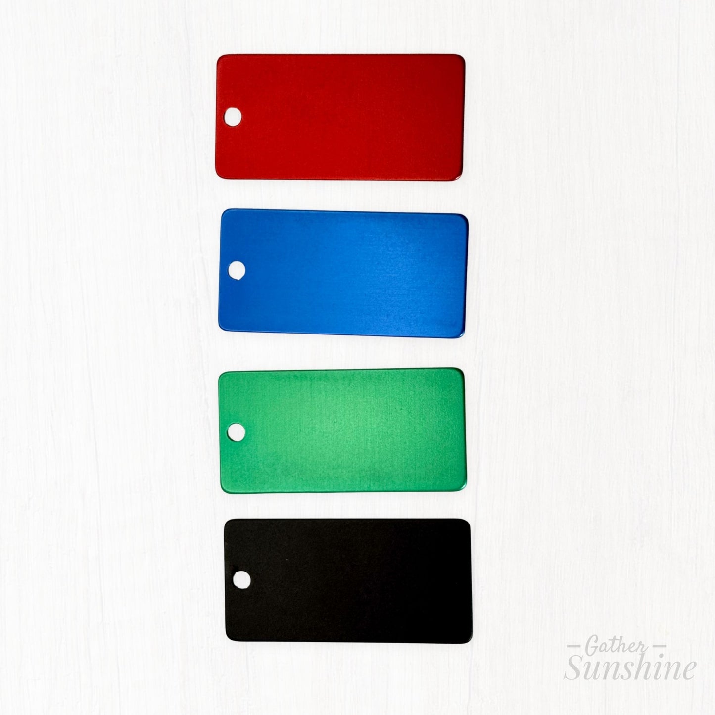 1x2 inch kids tag color options shown in red, blue, green, and black. No engraving or clasp included in this image