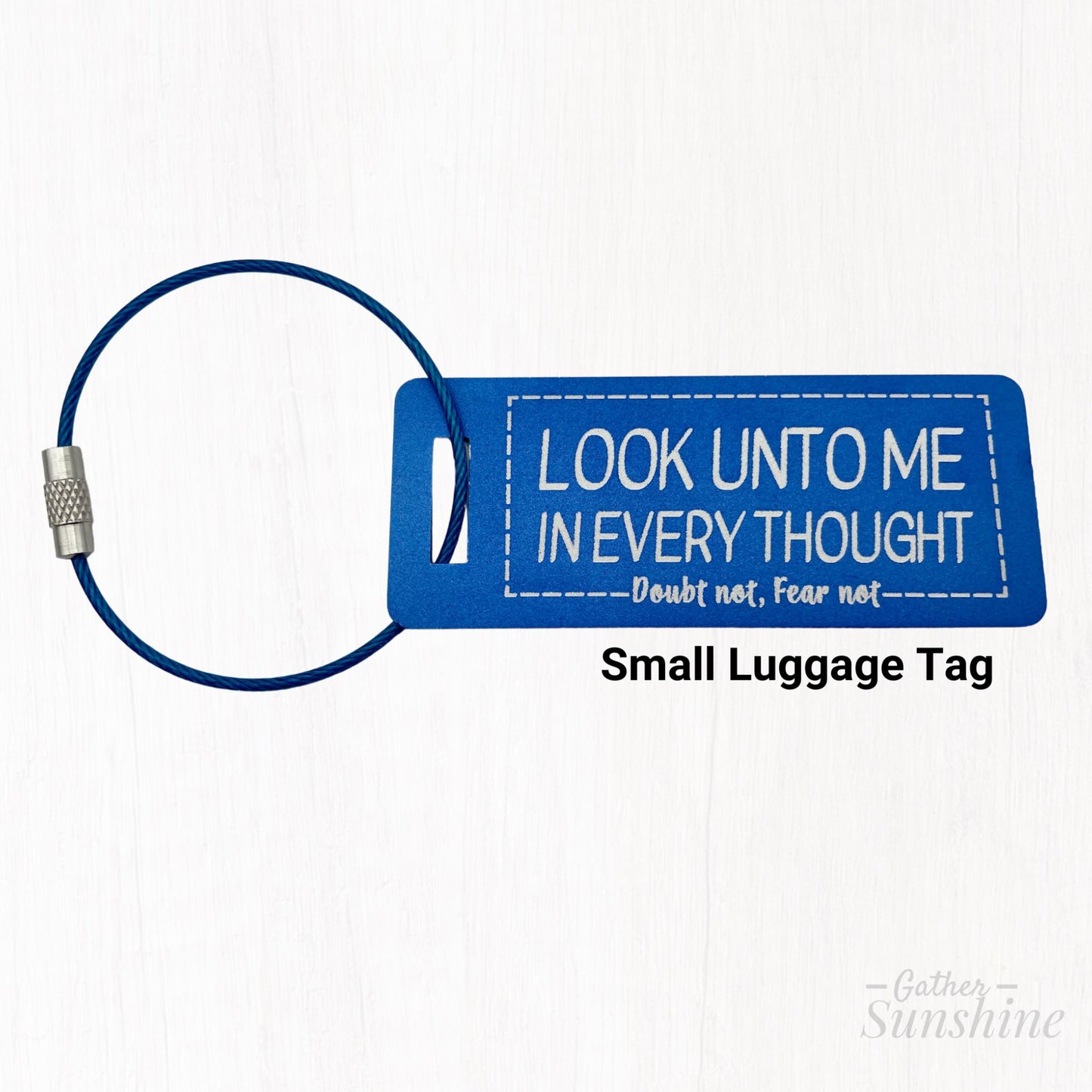 Small, blue luggage tag with motivational text "Look Unto Me In Every Thought, Doubt Not, Fear Not" by Gather Sunshine.