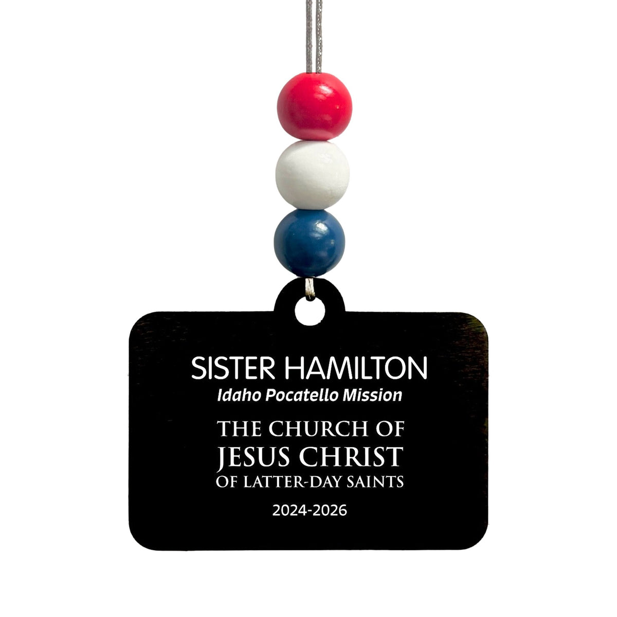 Bead option F on the English missionary name tag ornament: red, white and navy blue beads.
