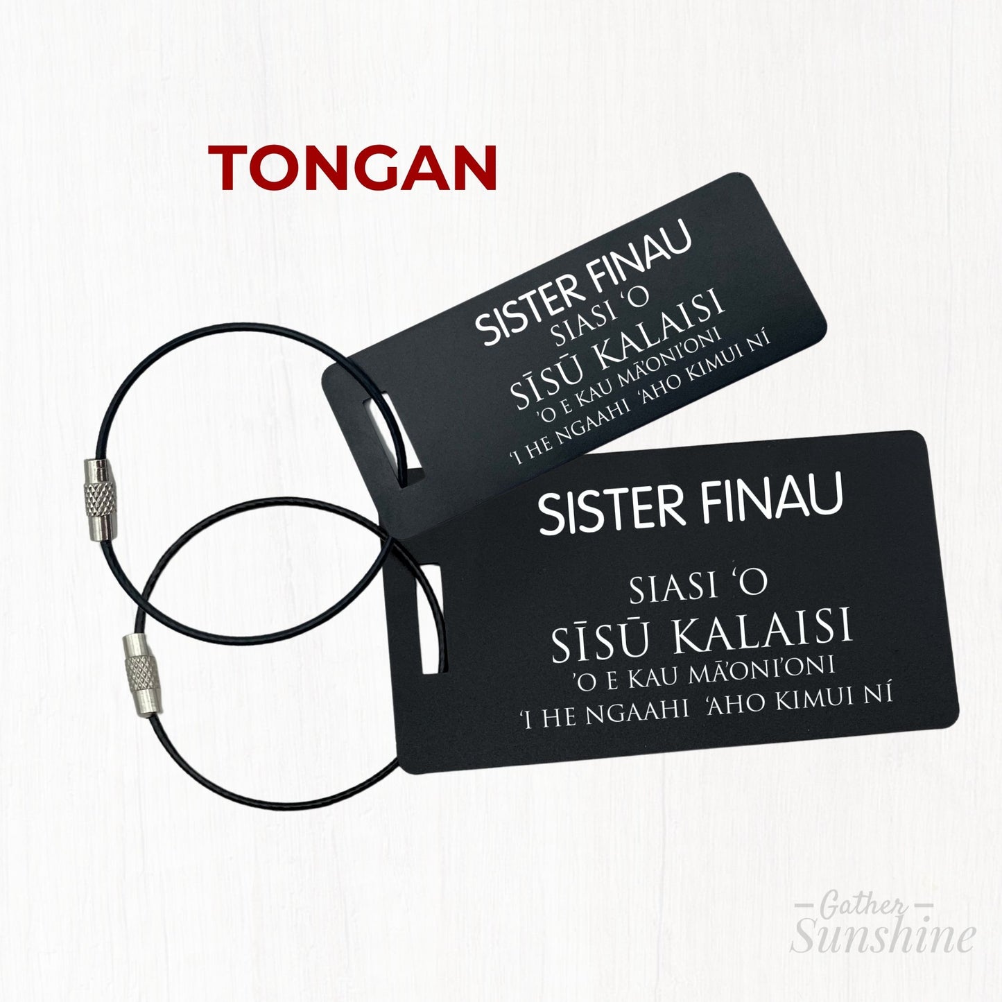 Small (3x1 inch) and large (3.5x2 inch) missionary-style tags in Tongan, personalized and engraved on black aluminum. A practical and personal gift by GatherSunshine.