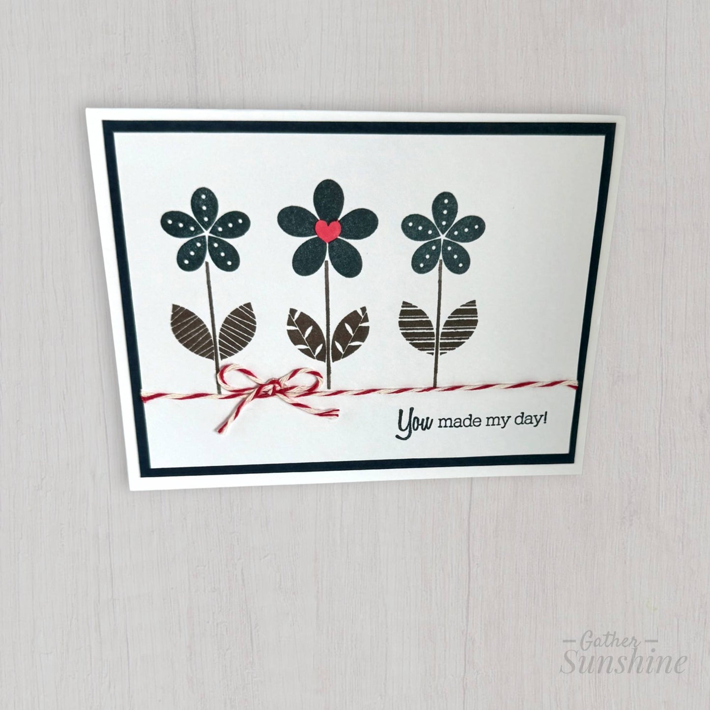 Card with floral design and text 'You made my day!' on a gray background by Gather Sunshine