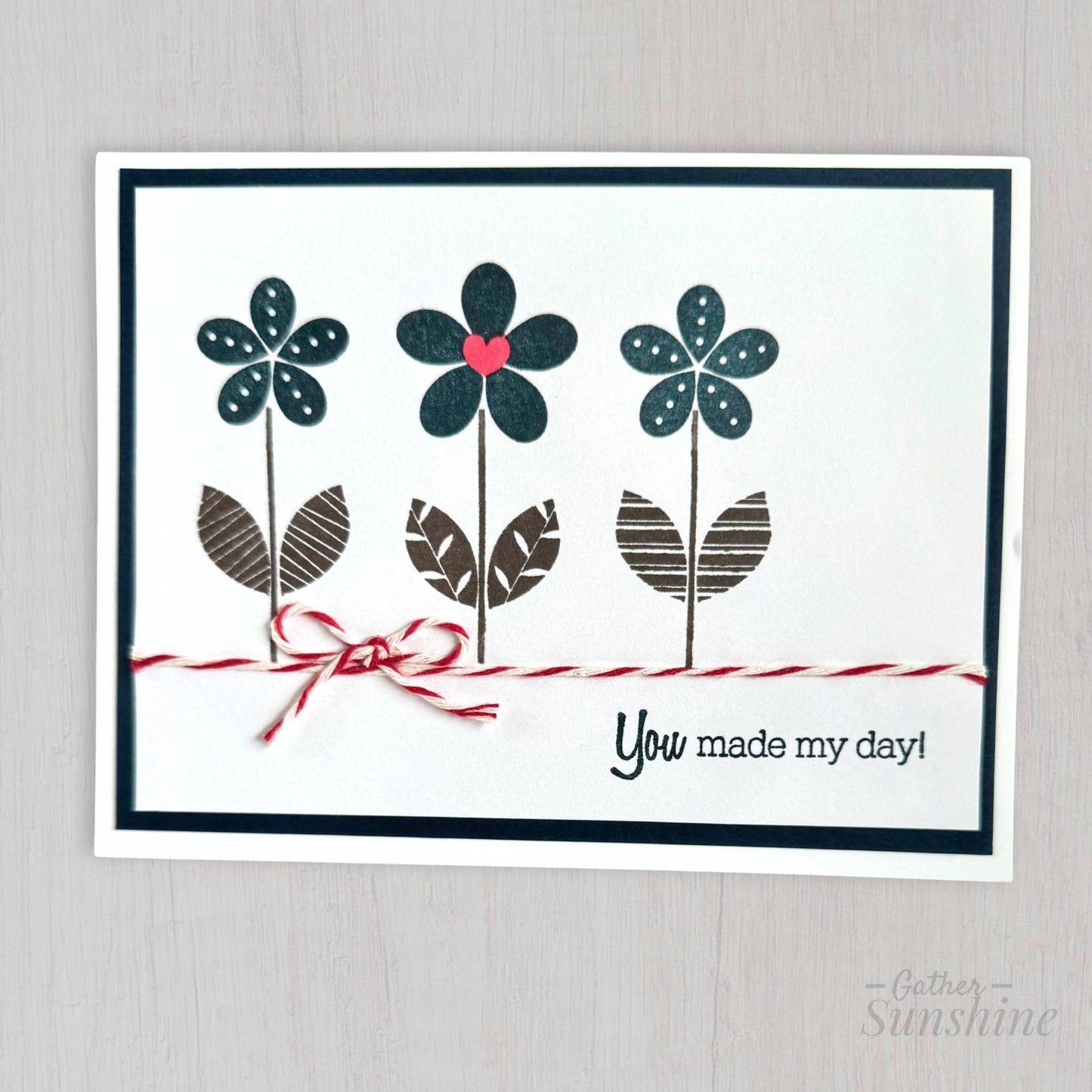 Handmade navy flower thank you card with red heart, red-and-white bow, and “You made my day” stamp, Gather Sunshine stationery