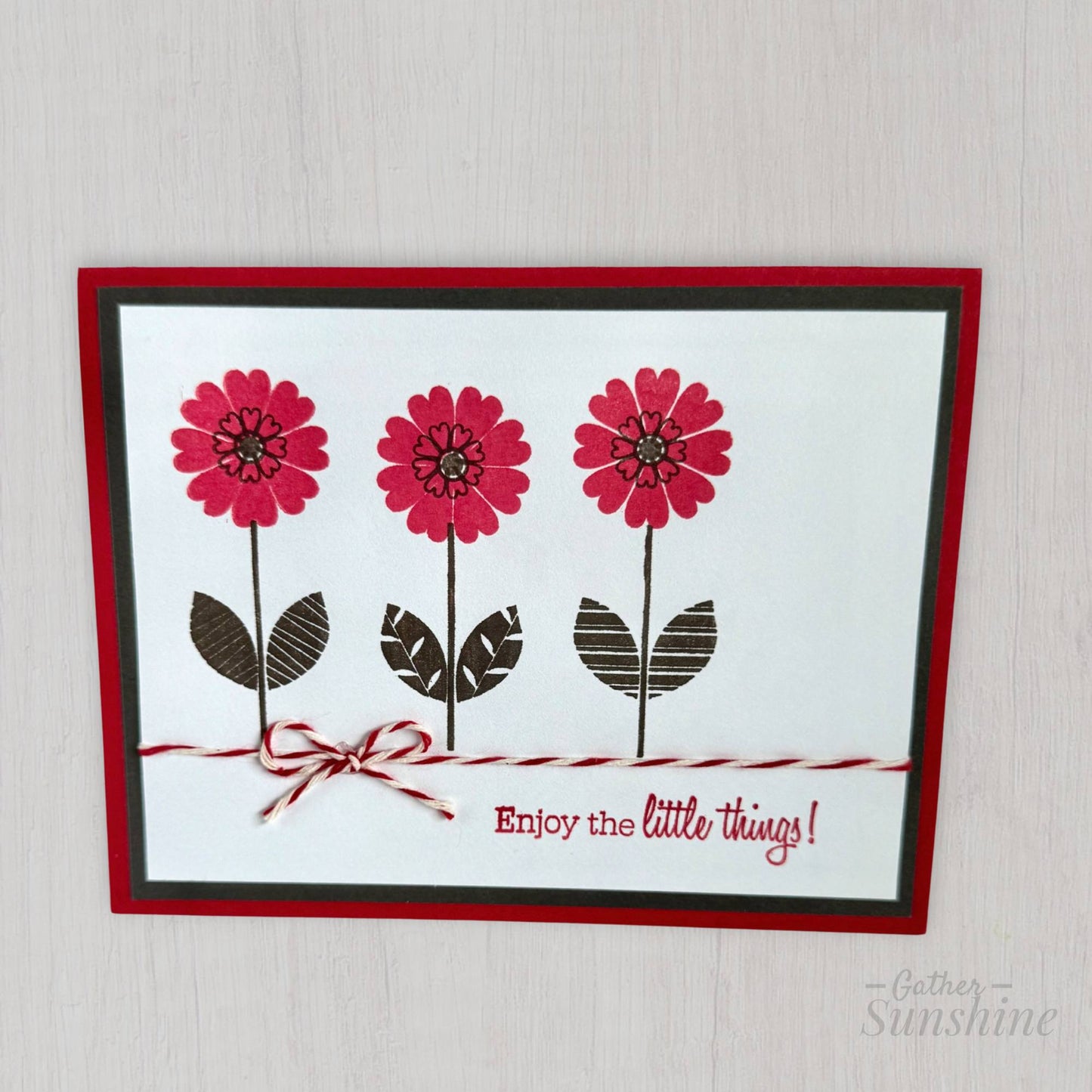 Hand-stamped red and black floral greeting card standing upright, layered paper design, created by Gather Sunshine
