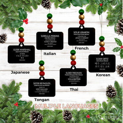 Additional language examples for the personalized missionary name tag ornament, each shown with a hanging bead arrangement.