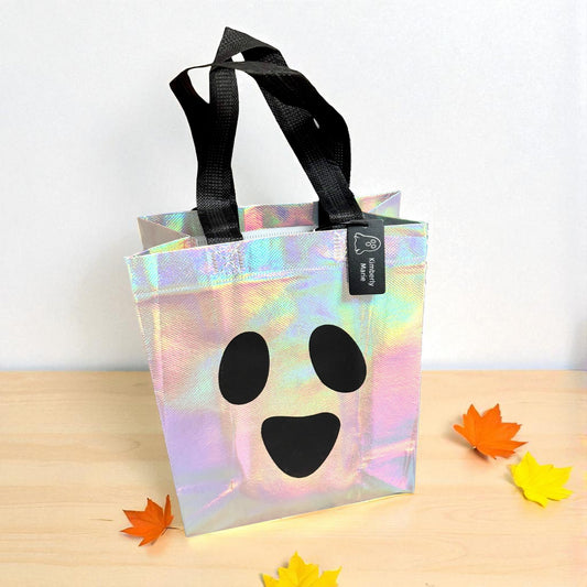 Iridescent ghost Halloween trick-or-treat bag with personalized engraved tag by Gather Sunshine.