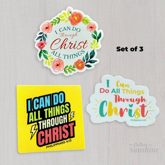 Set of three ‘I Can Do All Things Through Christ’ designs – floral circular pink and green, multicolor script with sunburst, and bold superhero comic style – 3 inch Christian stickers or magnets by Gather Sunshine.