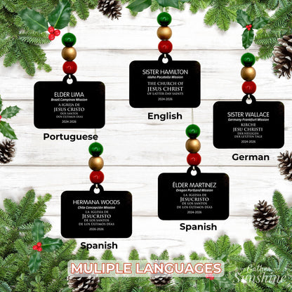 Examples of personalized missionary name tag ornaments in several languages, displayed with different bead colors.