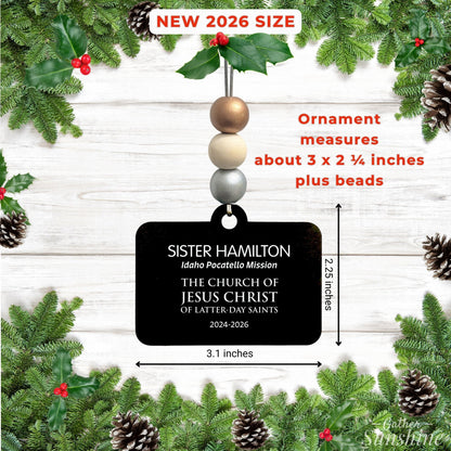 Missionary name tag ornament with callouts showing its approximate size and the personalized details on the tag.