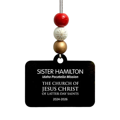 Bead option A on the English missionary name tag ornament: red, white snowflake and bronze beads.