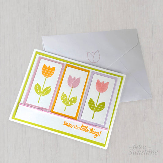 Handmade tulip greeting card with stamped flowers, string bow, and “Enjoy the little things” phrase, paired with envelope by Gather Sunshine